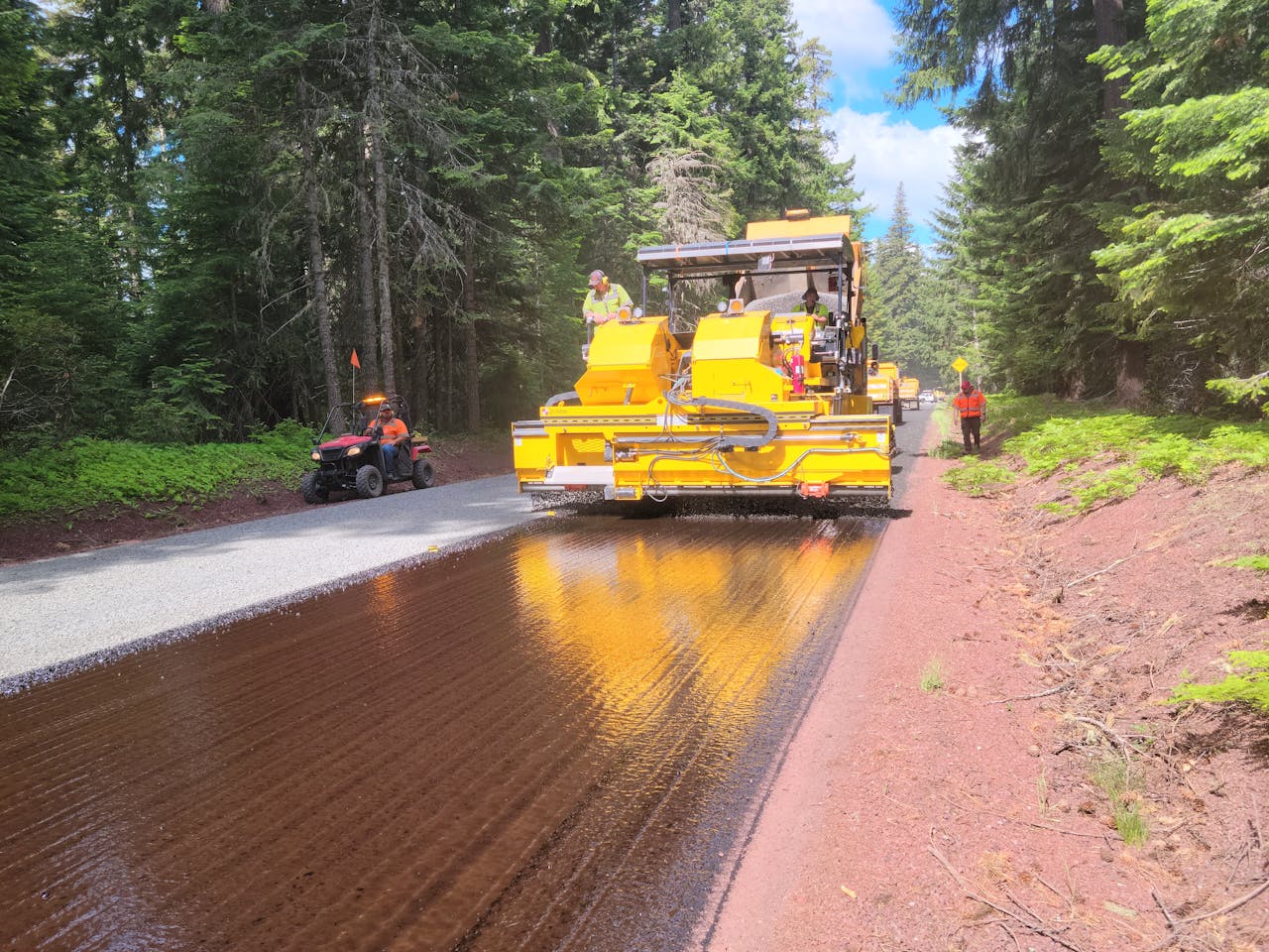 services-01 Paving machine working on a road through Mount Hood forested area.